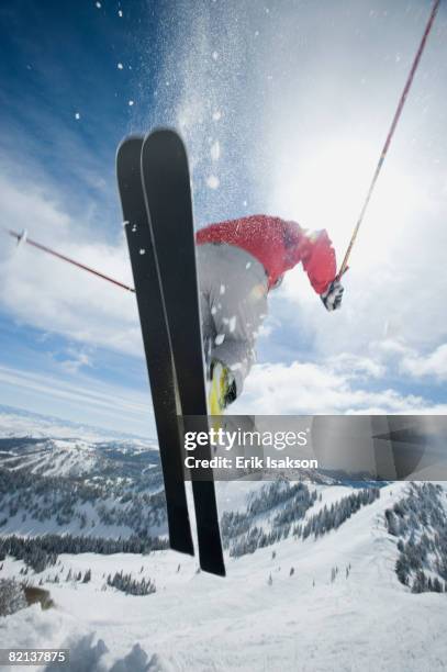 man in air on skis - alpine skiing stock pictures, royalty-free photos & images