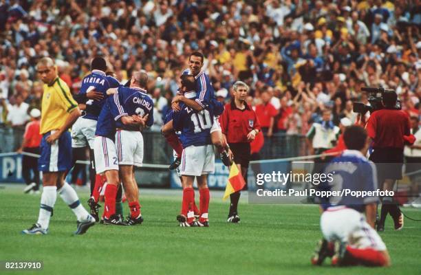 World Cup Final, St Denis, Paris, France, 12th July France 3 v Brazil 0, France's Zinedine Zidane with team-mate Djorkaeff after their victory