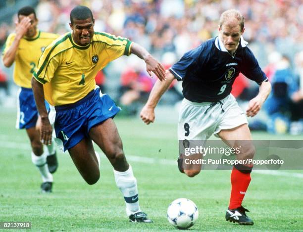 World Cup Finals, St, Denis, France, 10th June Brazil 2 v Scotland 1, Brazil's Junior Baiano races with Scotland's Gordon Durie for the ball