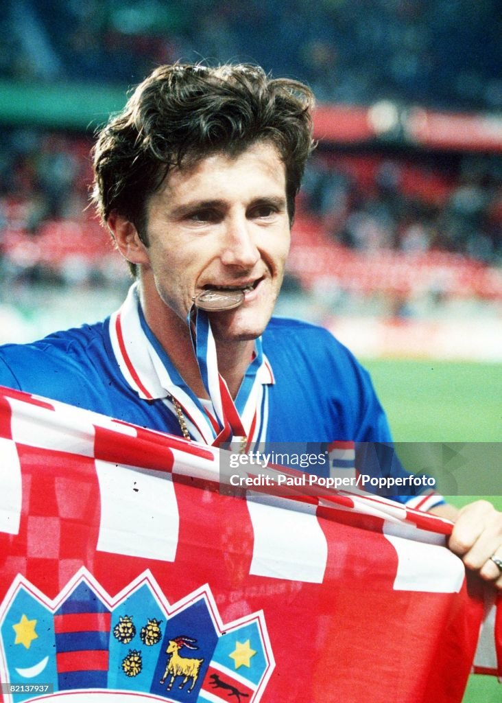 1998 World Cup Finals, St, Denis, France, 11th JULY 1998, Third Place Play-Off, Croatia 2 v Holland 1, Croatia's Davor Suker bites his Third place medal after the match, Suker finished top scorer in the tournament with six goals