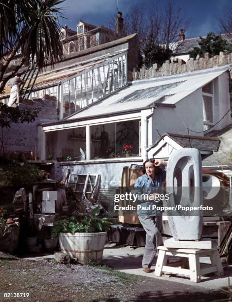 St Ives, Cornwall, England, May 1957, English sculptor Barbara Hepworth is pictured with some of her completed works