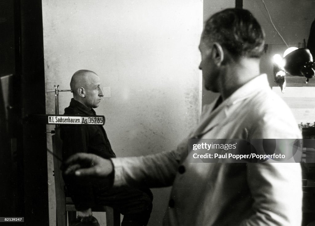 War and Conflict, World War Two, pic: February 1941, A new inmate being photographed on his arrival at the German concentration camp at Sachsenhausen, The camp opened in 1936 and the Nazis held there Jews and political prisoners, and later Russian prisone