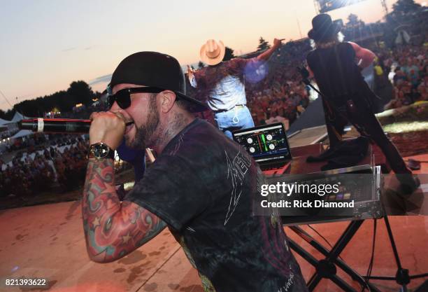 Sinister joins Big Kenny and John Rich of Big and Rich onstage during Country Thunder - Day 4 on July 23, 2017 in Twin Lakes, Wisconsin.