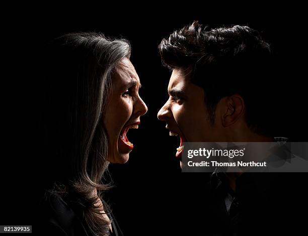 mature woman and teen boy yelling - gezicht aan gezicht stockfoto's en -beelden