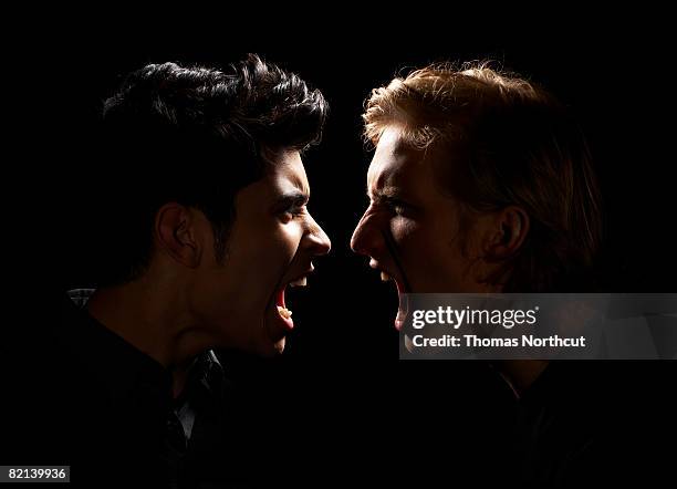 teen boy and adult male yelling - ilska bildbanksfoton och bilder