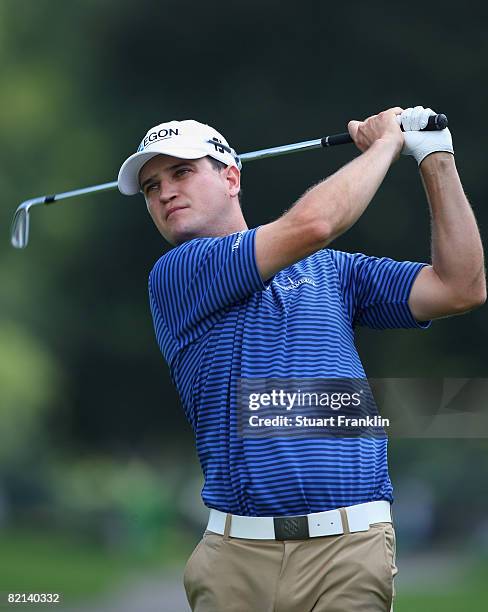 Zach Johnson of the U.S. Plays his approach shot on the eighth hole during first round of the World Golf Championship Bridgestone Invitational on...