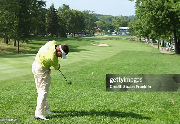 Lee Westwood of England plays his approach shot on the 16th hole during first round of the World Golf Championship Bridgestone Invitational on July...