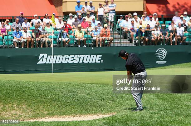 Phil Mickelson of the U.S. Plays his approach shot on the nineth hole during first round of the World Golf Championship Bridgestone Invitational on...