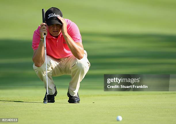 Martin Kaymer of Germany lines up his putt on the 18th hole during first round of the World Golf Championship Bridgestone Invitational on July 31,...