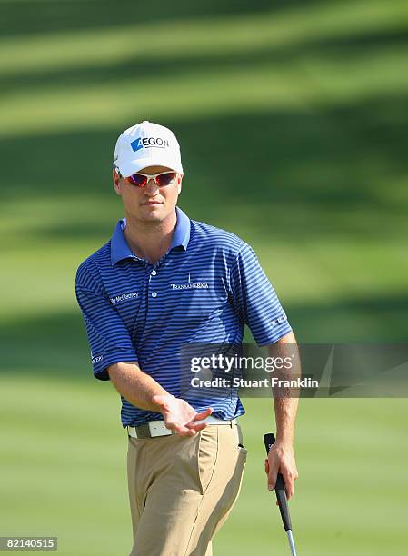 Zach Johnson of the U.S. Catches his ball on the 18th hole during first round of the World Golf Championship Bridgestone Invitational on July 31,...
