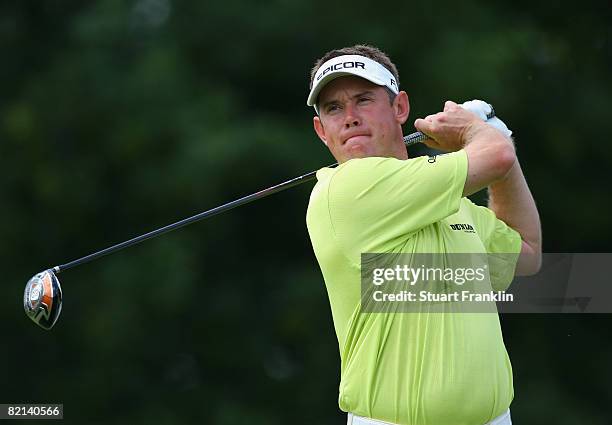 Lee Westwood of England plays his tee shot on the 14th hole during first round of the World Golf Championship Bridgestone Invitational on July 31,...