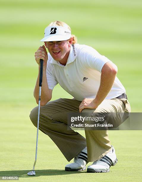 Brandt Snedeker of the U.S. Lines up a putt on the 15th hole during first round of the World Golf Championship Bridgestone Invitational on July 31,...
