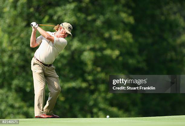 Miguel Angel Jimenez of Spain plays his approach shot on the 16th hole during first round of the World Golf Championship Bridgestone Invitational on...