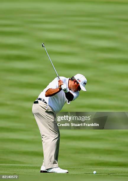 Angel Cabrera of Argentina plays his approach shot on the eighth hole during first round of the World Golf Championship Bridgestone Invitational on...
