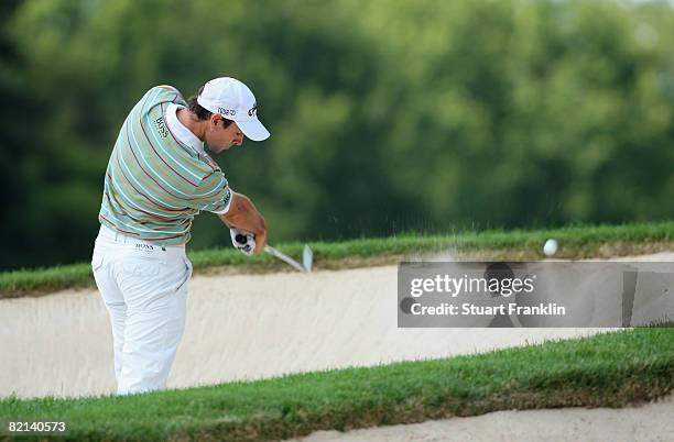 Oliver Wilson of England plays his bunker shot on the 16th hole during first round of the World Golf Championship Bridgestone Invitational on July...