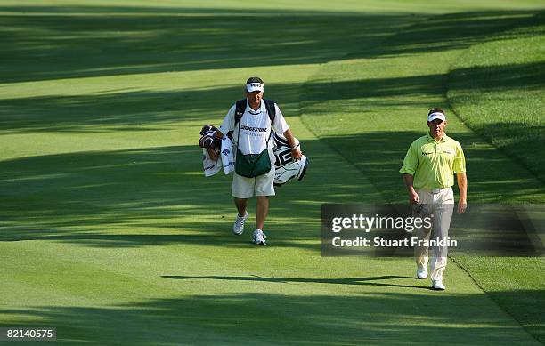 Lee Westwood of England and caddie Alastair McClean during first round of the World Golf Championship Bridgestone Invitational on July 31, 2008 at...