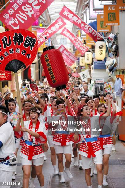 The popular "Gal Mikoshi" is paraded at Tenjinbashisuji shopping street on July 23, 2017 in Osaka, Japan. The troop of 80 women, from 15 to 30 years...