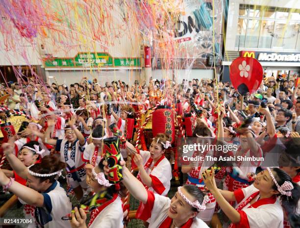 The popular "Gal Mikoshi" is paraded at Tenjinbashisuji shopping street on July 23, 2017 in Osaka, Japan. The troop of 80 women, from 15 to 30 years...