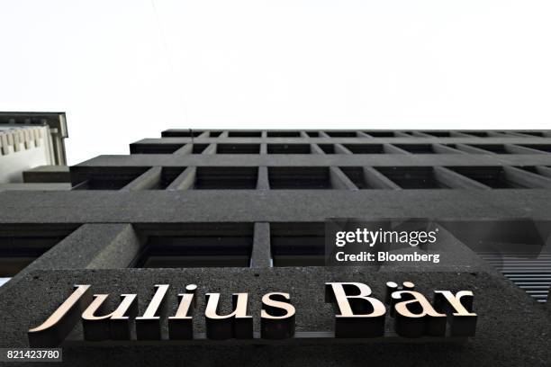 The logo of Julius Baer Group Ltd. Sits above the entrance to their headquarters office in Zurich, Switzerland, on Monday, July 24, 2017. Julius Baer...