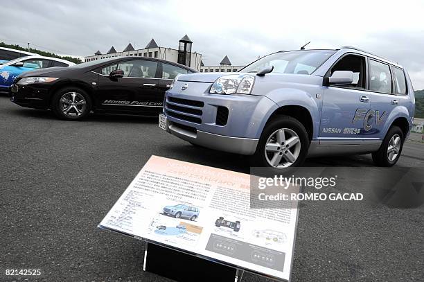 In this picture taken on July 9 Nissan X-Trail FCV hydrogen powered vehicles stand on display at the G8 Summit media centre in Rusutsu. Japan's...