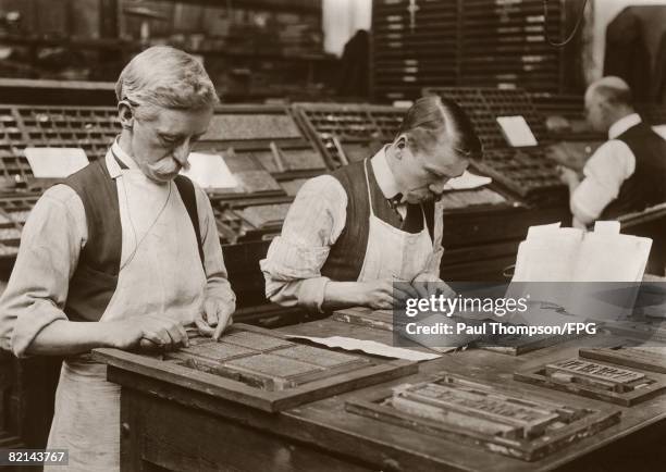 Printers alter the printing plates of prayerbooks to include the name of the new King George V, by order of the Council, 1910.