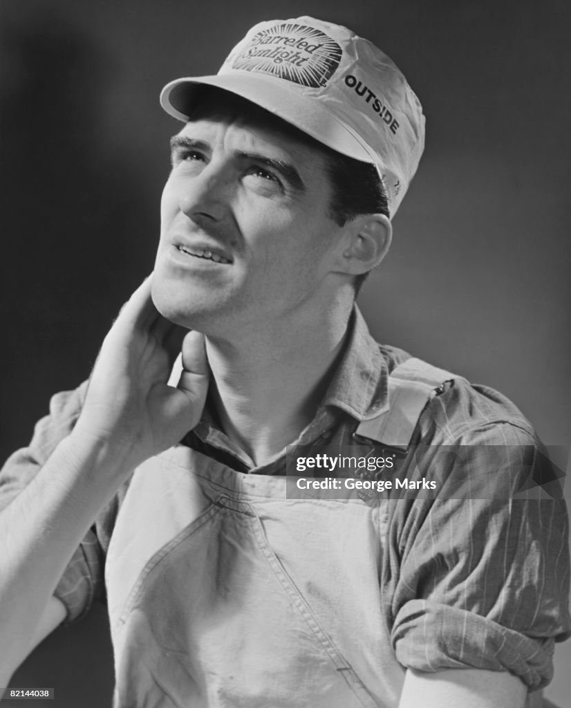 Manual worker in studio, (B&W)