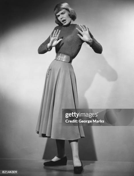 woman making stop gesture in studio, (b&w), portrait - angry woman vintage stock pictures, royalty-free photos & images