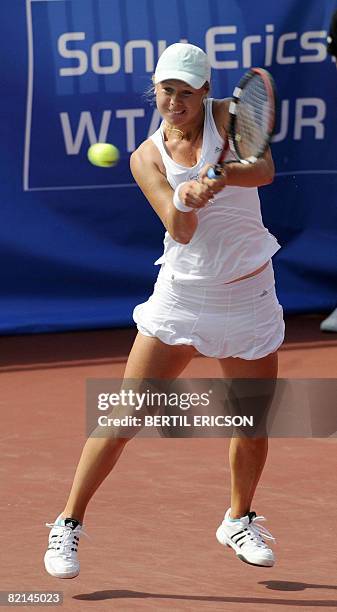 Vera Dushevina of Russia returns a shot to Iveta Benesova of the Czech Republic during their Nordic Light tennis tournament quarterfinal on August 1...