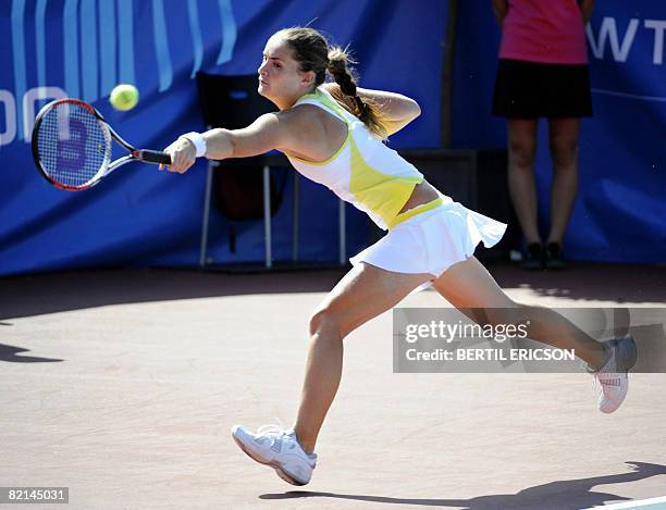 Iveta Benesova of the Czech Republic returns a shot to Vera Dushevina of Russia during their Nordic Light tennis tournament quarterfinal on August 1...