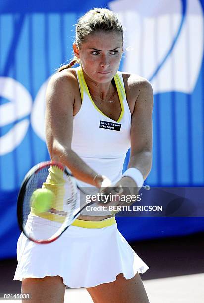 Iveta Benesova of the Czech Republic returns a shot to Vera Dushevina of Russia during their Nordic Light tennis tournament quarterfinal on August 1...