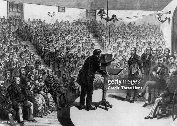 Scottish inventor Alexander Graham Bell demonstrating his telephone at the Lyceum Hall in Salem, Massachusetts, 15th March 1877.