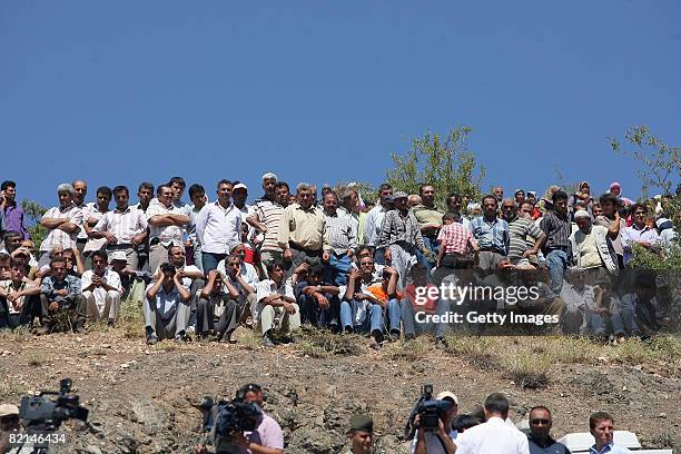 Villagers watch rescue operations at the wreckage of a girls' school dormitory from a nearby hill on August 1, 2008 in the village of Balcilar, Konya...