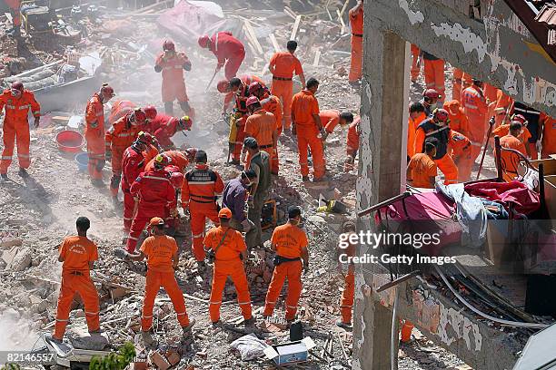 Rescue workers search for the victims in the wreckage of a girls' school dormitory August 1, 2008 in Balcilar, Konya province, Turkey. A three story...