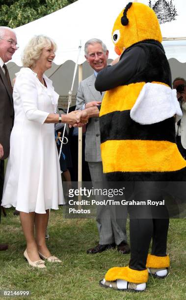 Prince Charles, Prince of Wales and Camilla, Duchess of Cornwall meet beekeeper, Barry Walker-Moore dressed as a Bumble Bee to raise awarness of a...