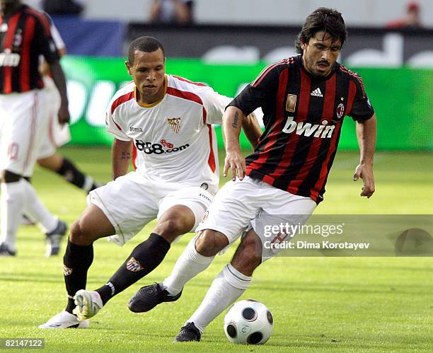 Gennaro Gattuso of A.C. Milan competes for the ball with Luis Fabiano of Sevilla during the Russian Railways Cup at the Lokomotiv Stadium on August...