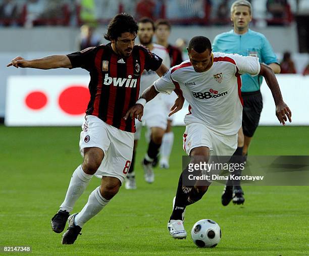 Gennaro Gattuso of A.C. Milan competes for the ball with Luis Fabiano of Sevilla during the Russian Railways Cup at the Lokomotiv Stadium on August...