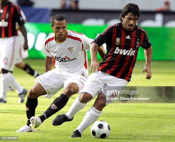 Gennaro Gattuso of A.C. Milan competes for the ball with Luis Fabiano of Sevilla during the Russian Railways Cup at the Lokomotiv Stadium on August...