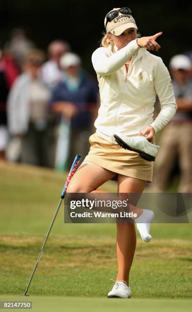 Morgan Pressel of the USA takes off her shoe on the 15th green during the second round of the 2008 Ricoh Women's British Open held on the Old Course...