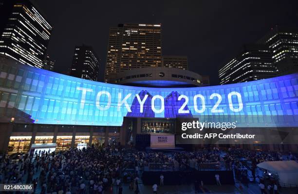 Projection that reads "Tokyo 2020" is seen during a ceremony marking three years to go before the start of the Tokyo 2020 Olympic games at the Tokyo...