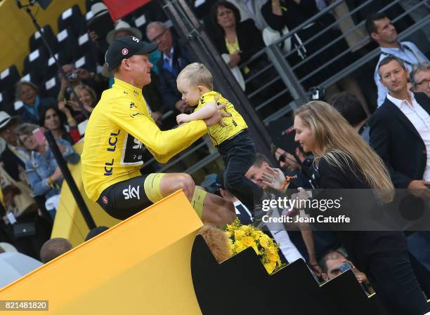 Christopher Froome of Great Britain and Team Sky, his wife Michelle Cound and their son Kellan Froome during the trophy ceremony following stage 21...