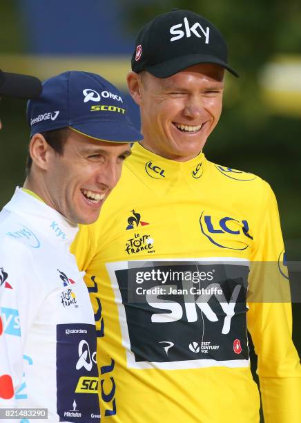 Best young rider Simon Yates of Great Britain and Orica-Scott and winner Christopher Froome of Great Britain and Team Sky during the trophy ceremony...