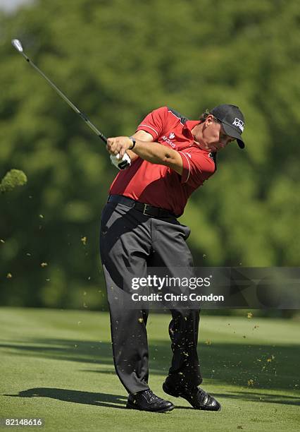 Phil Mickelson hits his second shot on during the second round of the World Golf Championships-Bridgestone Invitational held on the South Course at...