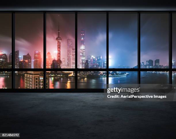 office window over a lit city - shanghai world financial center stock pictures, royalty-free photos & images