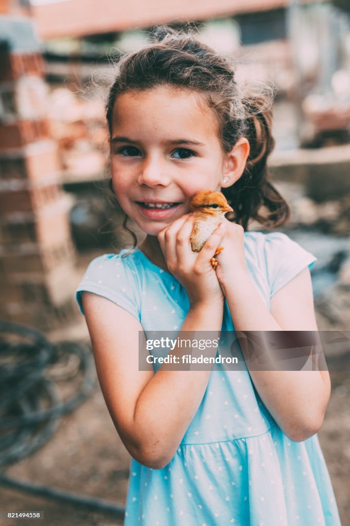 Girl with a little chicken
