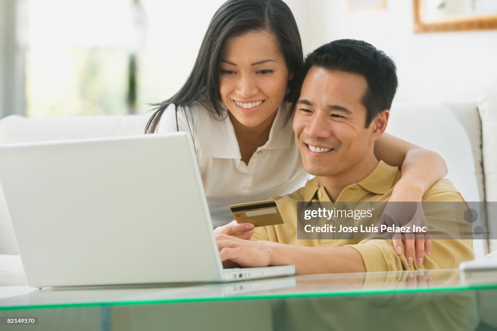 Asian couple shopping online