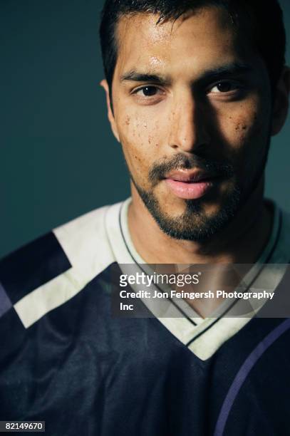 hispanic male soccer player with dirt on face - football player face stock pictures, royalty-free photos & images