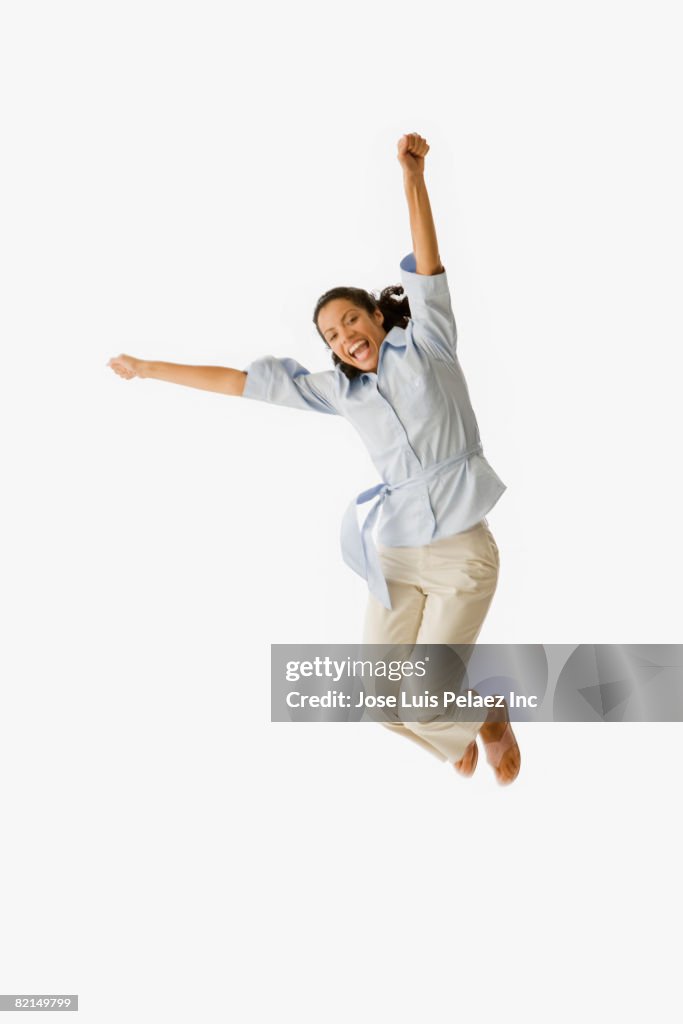 African woman jumping in air