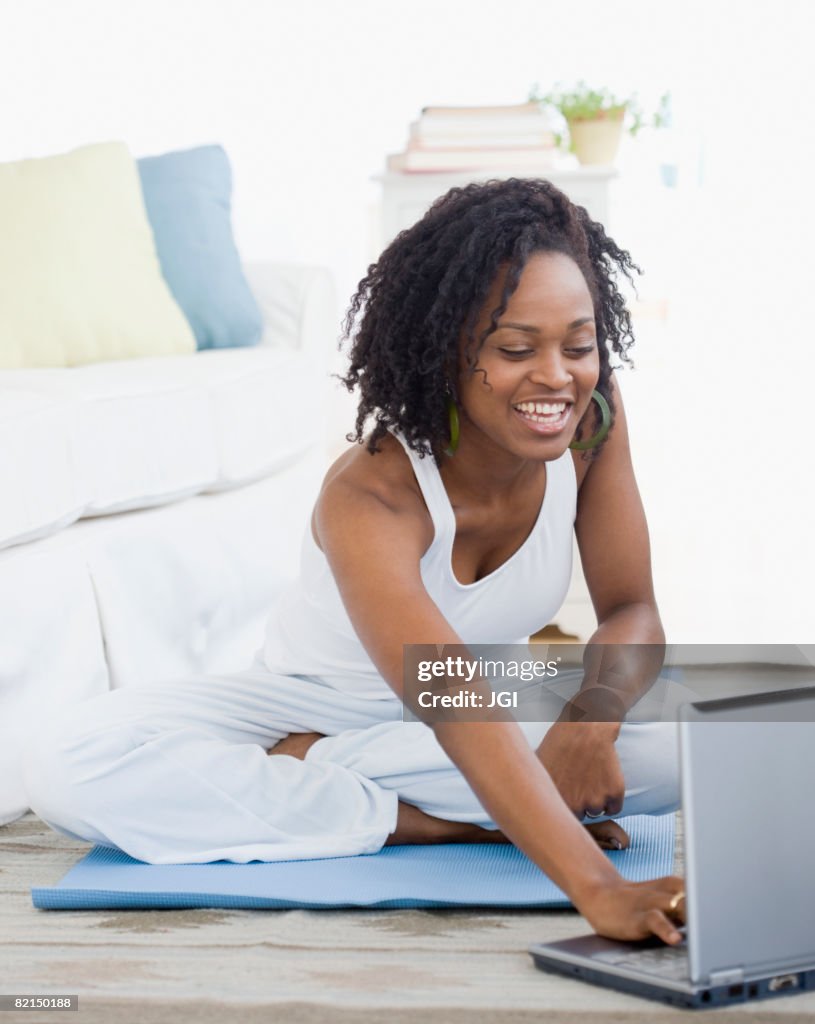 African woman looking at laptop