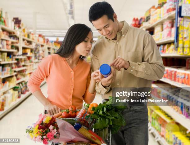 asian couple grocery shopping - tag 2 stock pictures, royalty-free photos & images