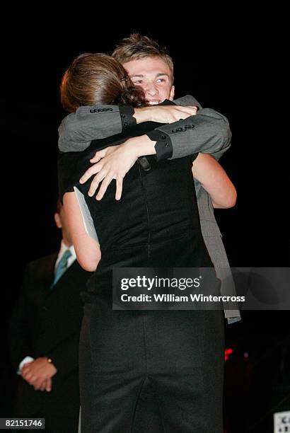 Programme host Davina McCall is hugged by Luke Marsden as he exits the house as the 7th person to be evicted from the Big Brother House at Elstree...
